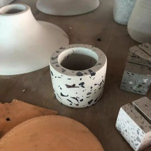 Handmade white terrazzo with colorful aggregates used for candle jar and candle holder