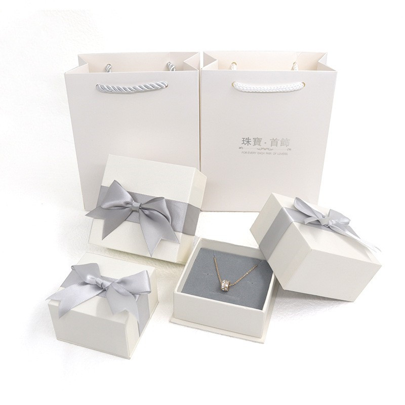 Caixa de agasallo de embalaxe de xoias de lazo de cartón personalizado con provedor de bolsas de asa