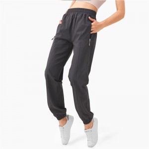 Nuvelli pantaloni di fitness a vita alta cù sacchetti di zip Pantaloni casuali svasati per donne in pesche per donna