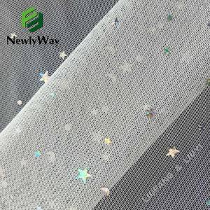 Bright sequin tulle fabric of stars and moons for the fairy skirt