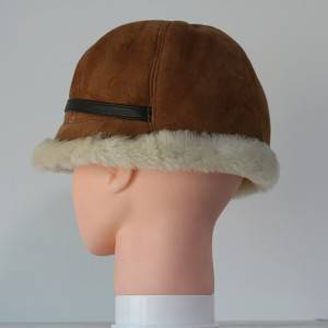 ladies sheepskin cloche hats feature a leather belt