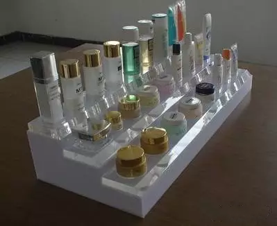 Why do cosmetics shops use Acrylic Display Racks as a display