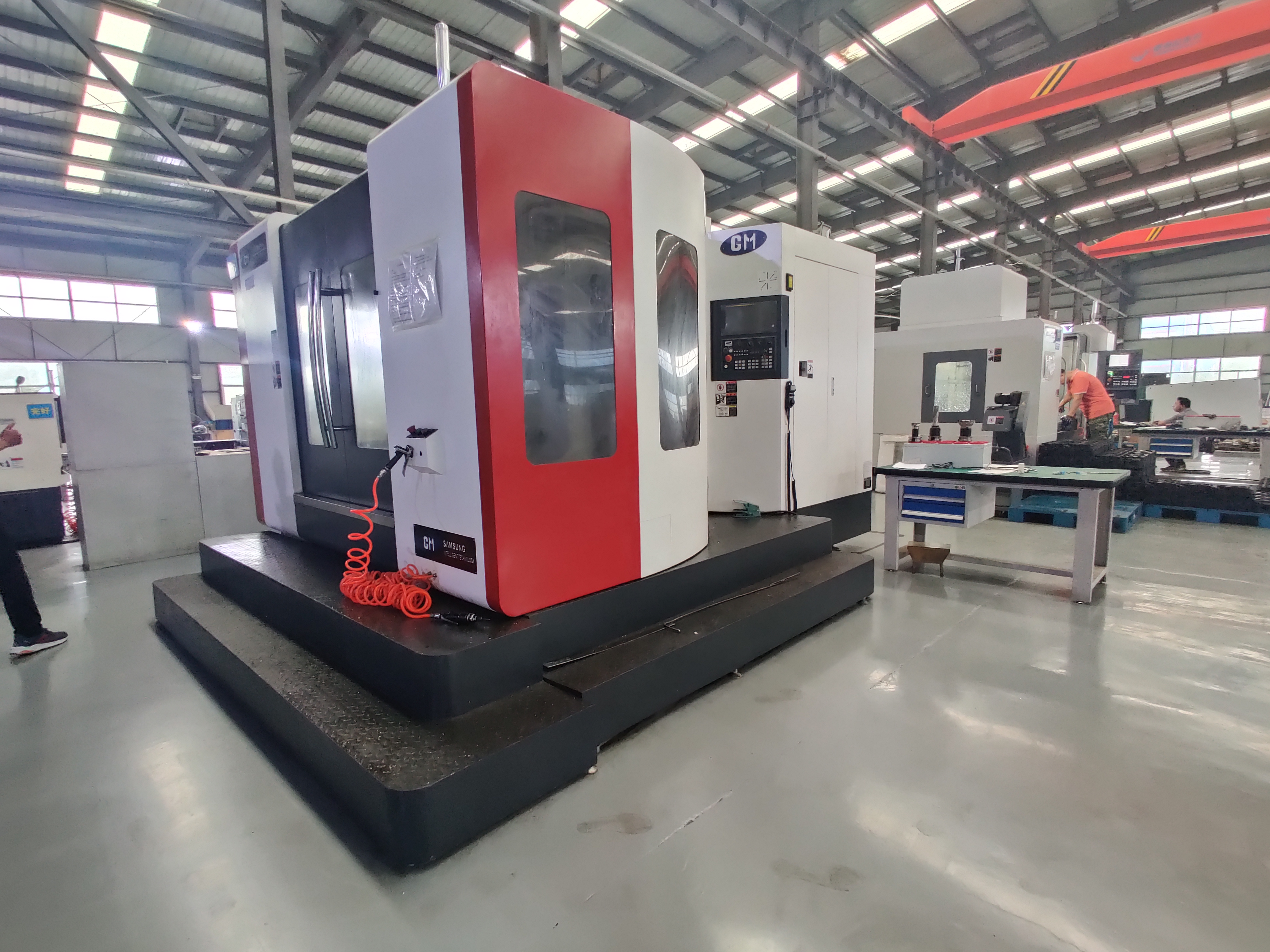 What can a four axis CNC machining center do?