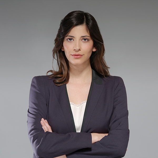 Portrait of young businesswoman, arms folded