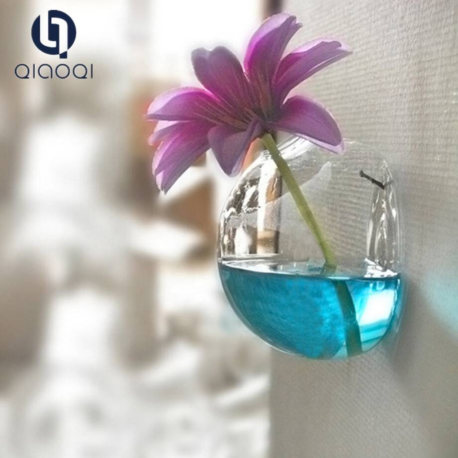 creative hanging glass vase on wall