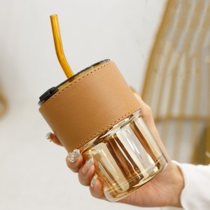 Glass cup with straw and lid