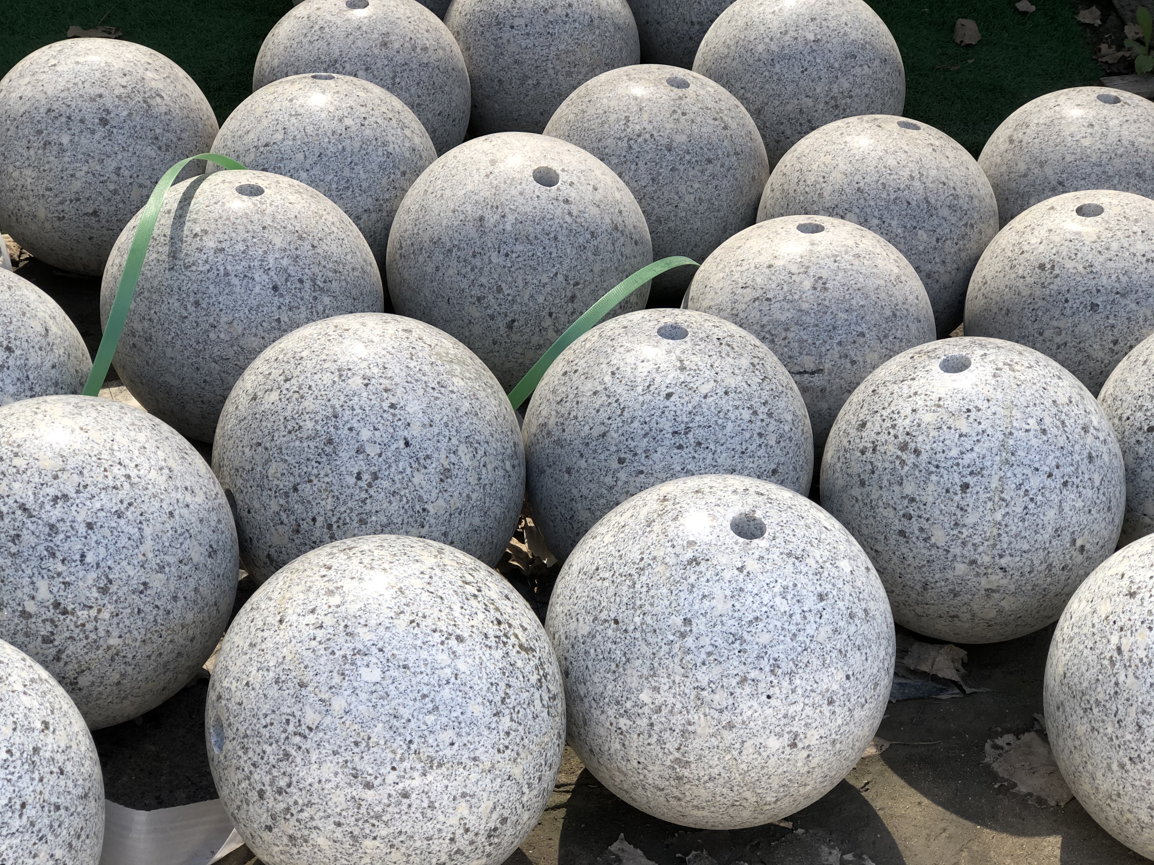 outdoor landscaping sculpture white grey marble sphere Featured Image