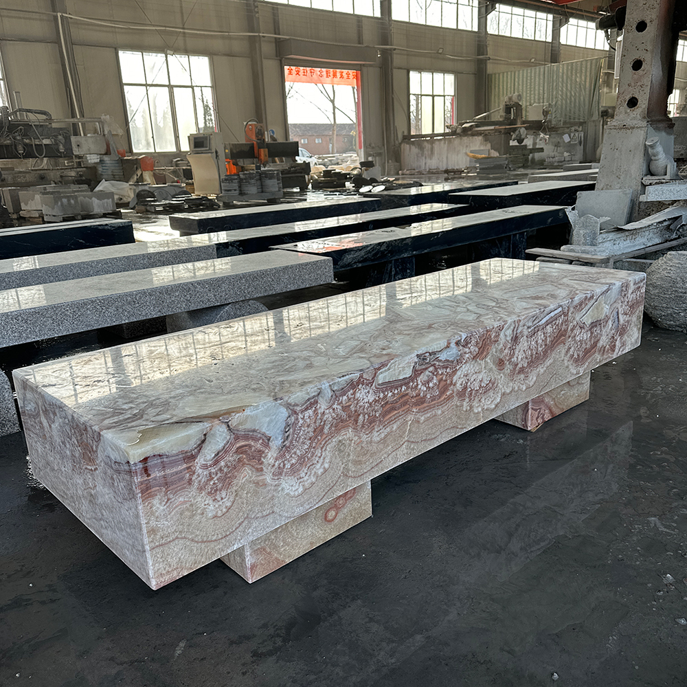 Absolutely, let’s explore the beauty and elegance that a marble bench can bring to garden decoration.