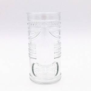 Cylindrical relief mask glass candle holder