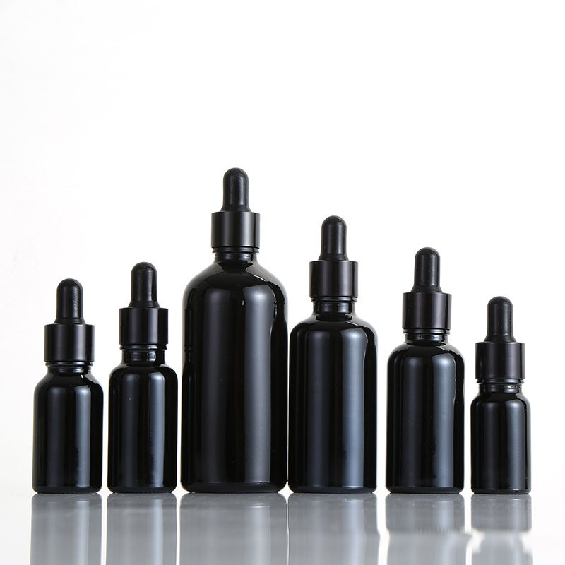 Black essential oil bottles cosmetic packaging Featured Image