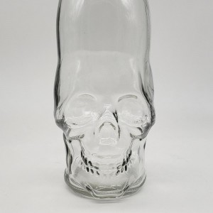 empty 700ml long neck skull shape liquor wne bottle with swing top