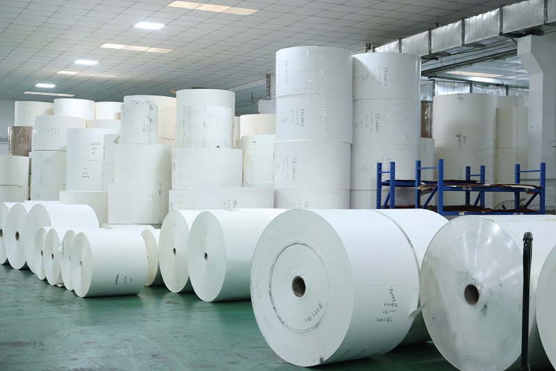 Which industries are coated paper used in?