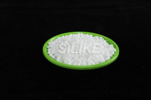 How does silicone additive improve PS processing and smooth surface?