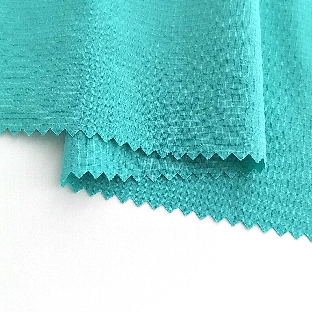 100% polyester 75D ຮູບແບບຕາຂ່າຍໄຟຟ້າ 4 ທາງ stretch fabric ສໍາລັບ trousers