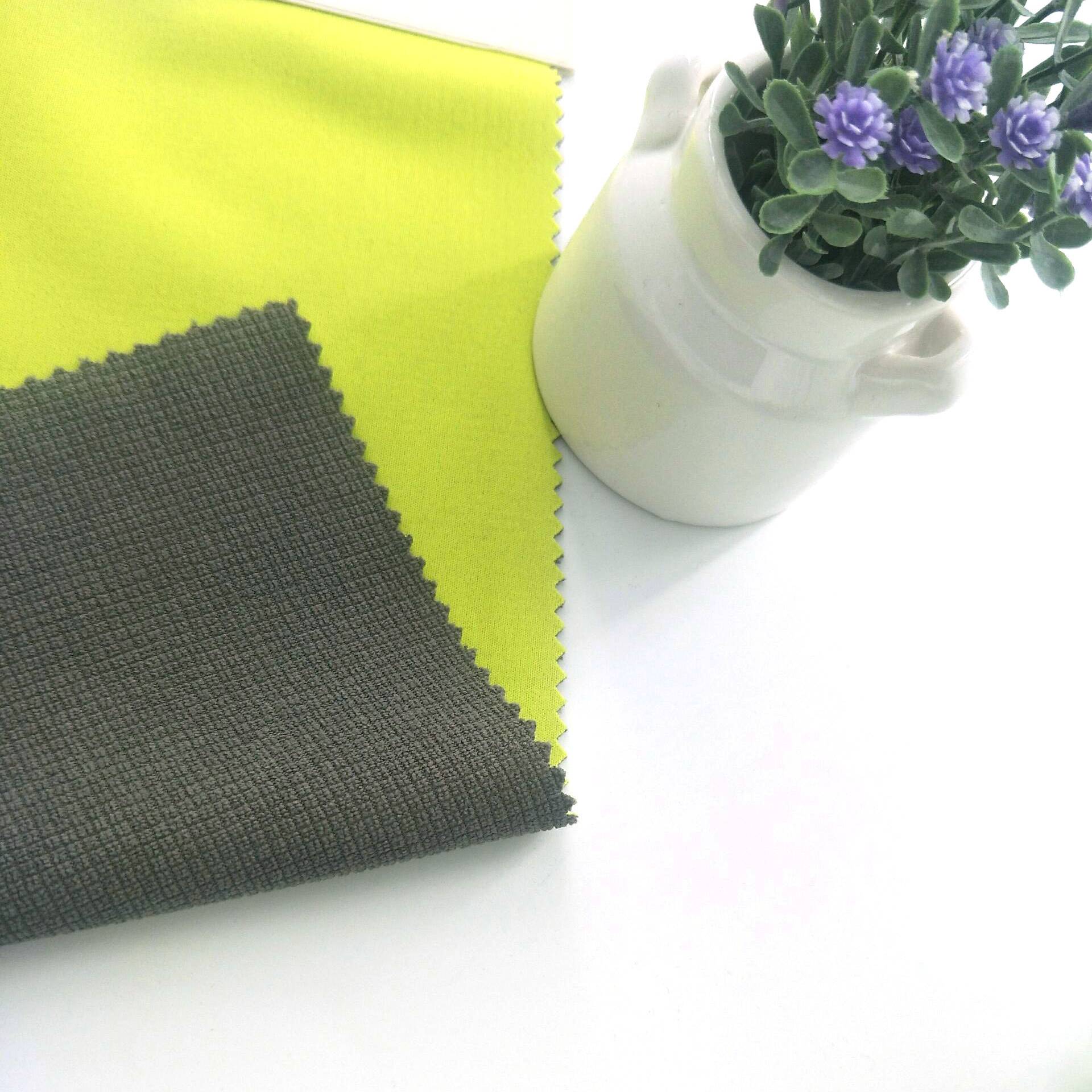 ຍອດຂາຍ 100% polyester interlock fabric ຜູກມັດຮູບເງົາ bonded ຕາຂ່າຍໄຟຟ້າ fleece ສໍາລັບກິລາ