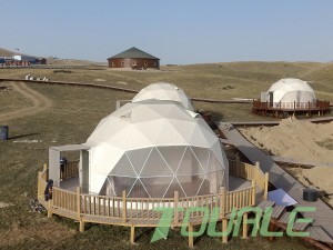A grassland camp consisting of 6 -meter diameter dome tent