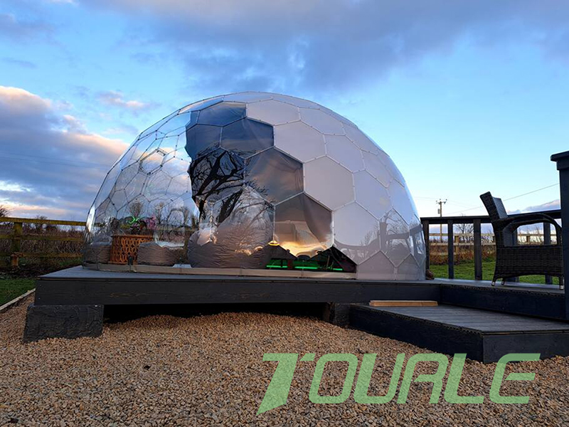 A fully transparent geodesico dome tent.