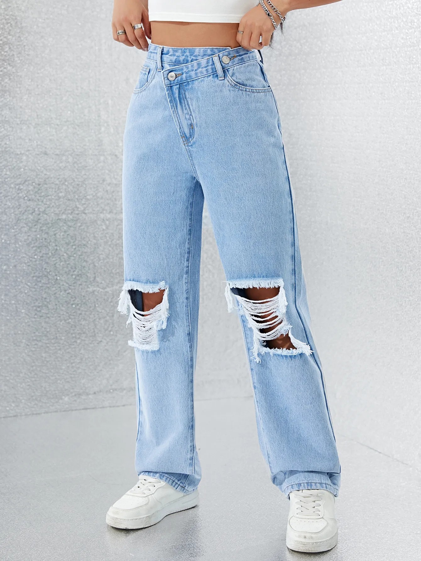 Asimmetrik bel öndürilen zawod göni jeans ýyrtdy