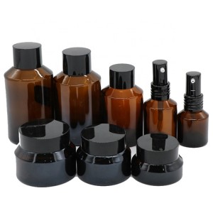 Hot sale cosmetic glass bottle and jar with black frosted amber color and pump spray dropper for essential oil serum packaging